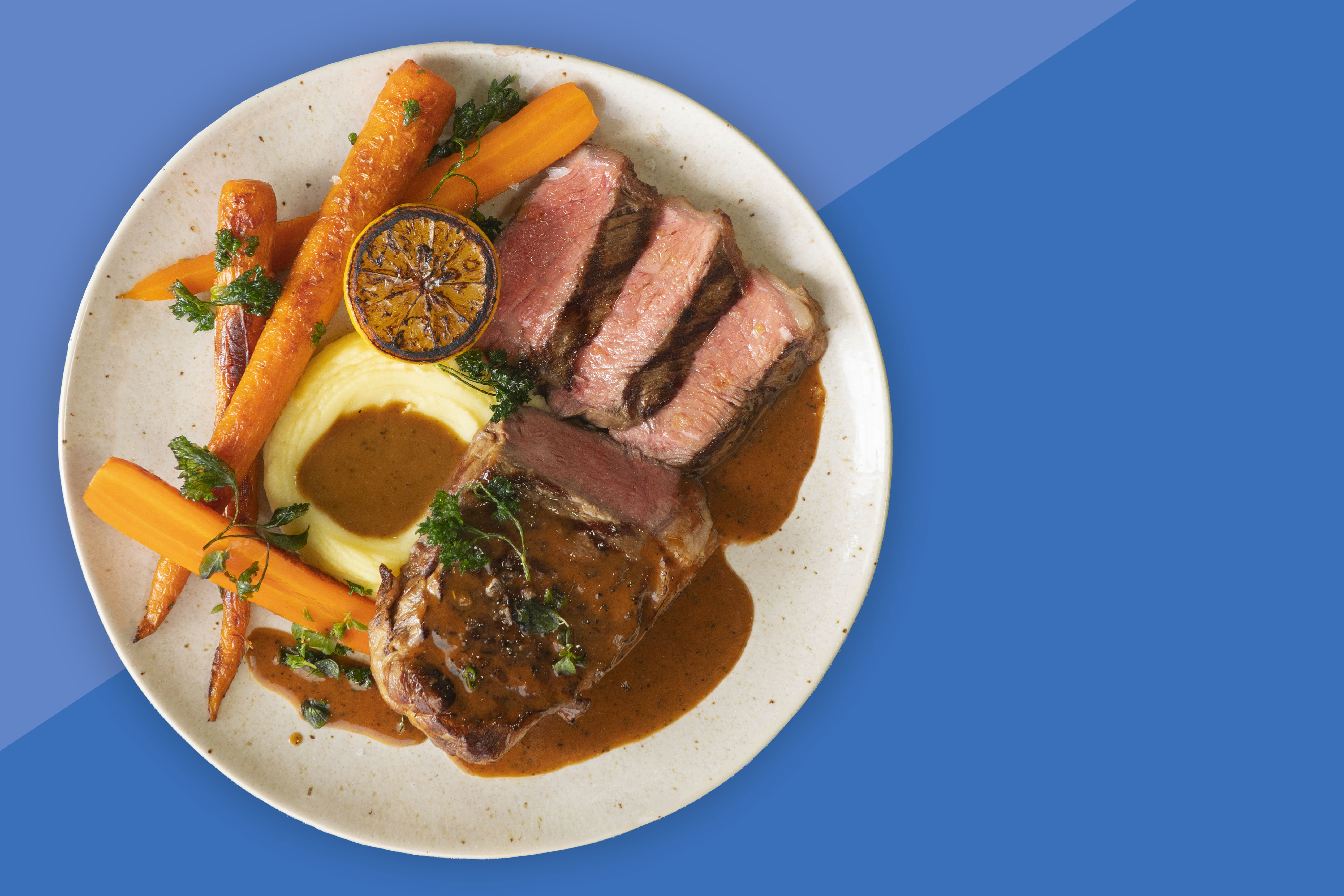 Steak With Périgord Black Truffle Sauce Over Mashed Potatoes and