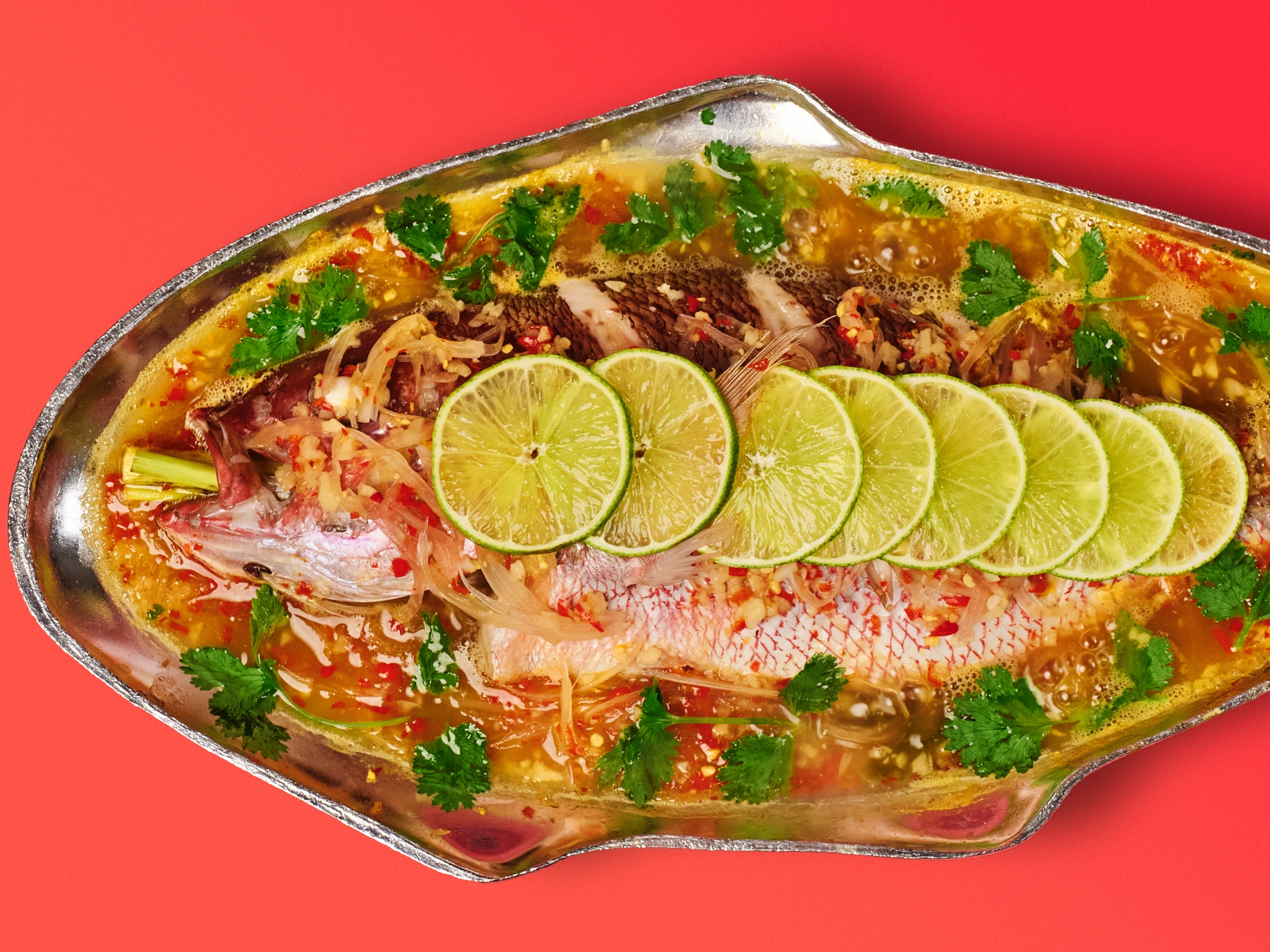 Thai-Style Steamed Fish With Garlic and Lime (Pla Gapong Neung Manao)
